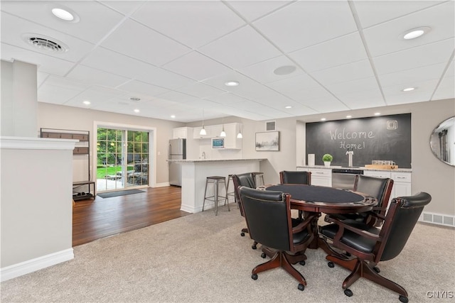 4314 Arbutus Dr, Pompey, NY 13104 - carpeted dining area featuring bar with sink, baseboards, a paneled ceiling, and recessed lighting