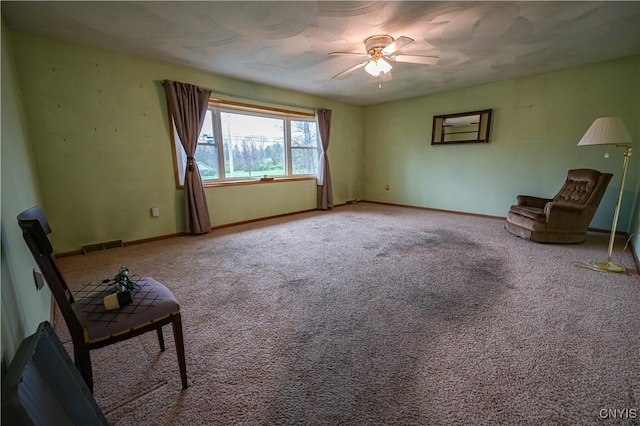 unfurnished room featuring ceiling fan, carpet, and baseboards