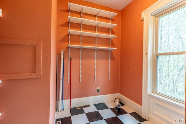 1957 Torpy Pond Rd, Georgetown, NY 13061 - clothes washing area with tile patterned floors, hookup for an electric dryer, and baseboards