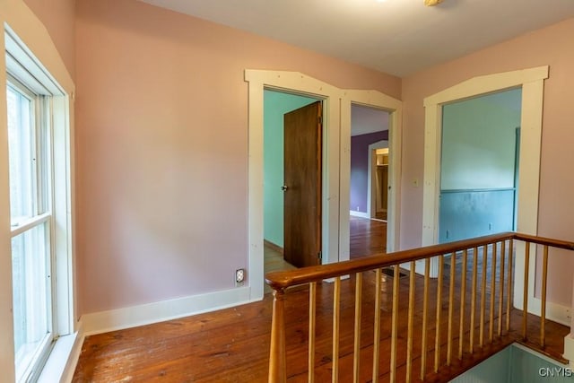 1957 Torpy Pond Rd, Georgetown, NY 13061 - corridor featuring wood finished floors, an upstairs landing, and baseboards