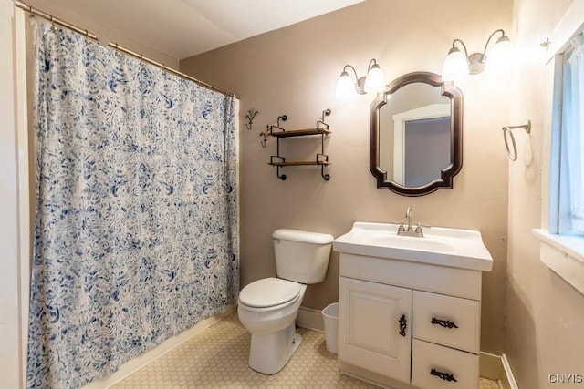 1957 Torpy Pond Rd, Georgetown, NY 13061 - bathroom with toilet, vanity, baseboards, tile patterned floors, and a shower with curtain