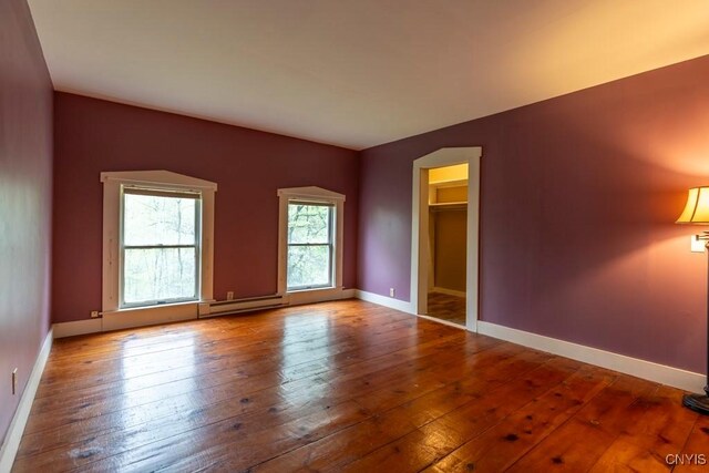 1957 Torpy Pond Rd, Georgetown, NY 13061 - empty room featuring hardwood / wood-style flooring, baseboards, and baseboard heating