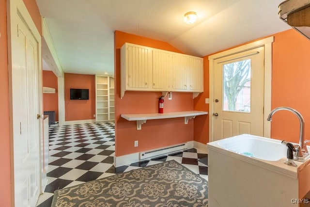 1957 Torpy Pond Rd, Georgetown, NY 13061 - laundry area with tile patterned floors, baseboard heating, baseboards, and radiator
