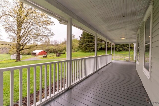 1957 Torpy Pond Rd, Georgetown, NY 13061 - deck with covered porch and a yard