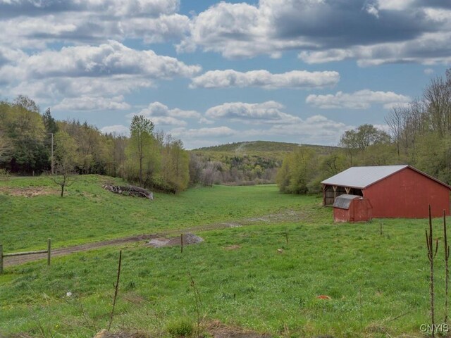 1957 Torpy Pond Rd, Georgetown, NY 13061 - view of grassy yard featuring a view of rural / pastoral area, a pole building, and an outdoor structure