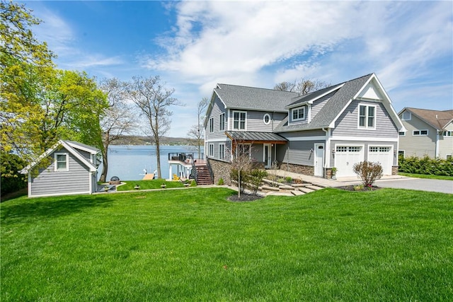5088 E Lake Rd, Gorham, NY 14544 - view of front of property featuring a garage, driveway, stairs, stone siding, and a front lawn
