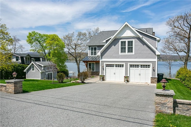 5088 E Lake Rd, Gorham, NY 14544 - shingle-style home with driveway, a front lawn, an attached garage, stone siding, and a chimney