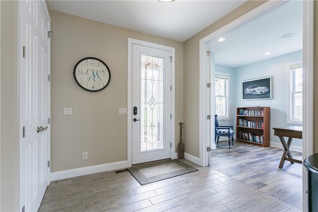 5088 E Lake Rd, Gorham, NY 14544 - entryway with light wood-style flooring, baseboards, and recessed lighting