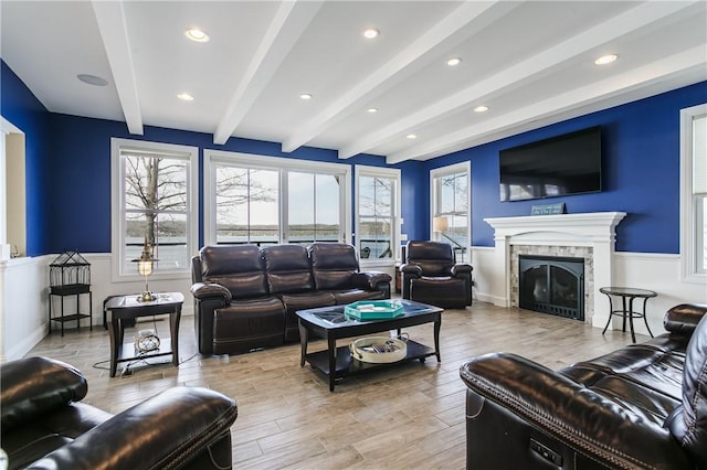5088 E Lake Rd, Gorham, NY 14544 - living area featuring beam ceiling, light wood-style flooring, wainscoting, a fireplace, and recessed lighting