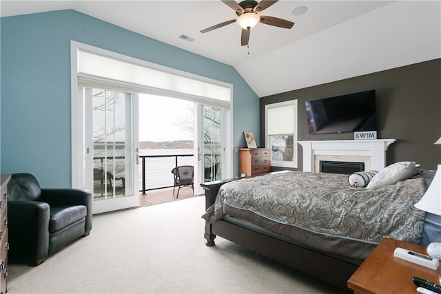 5088 E Lake Rd, Gorham, NY 14544 - carpeted bedroom with lofted ceiling, access to exterior, a fireplace, and a ceiling fan