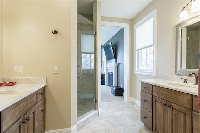 5088 E Lake Rd, Gorham, NY 14544 - full bathroom featuring baseboards, a stall shower, two vanities, and plenty of natural light