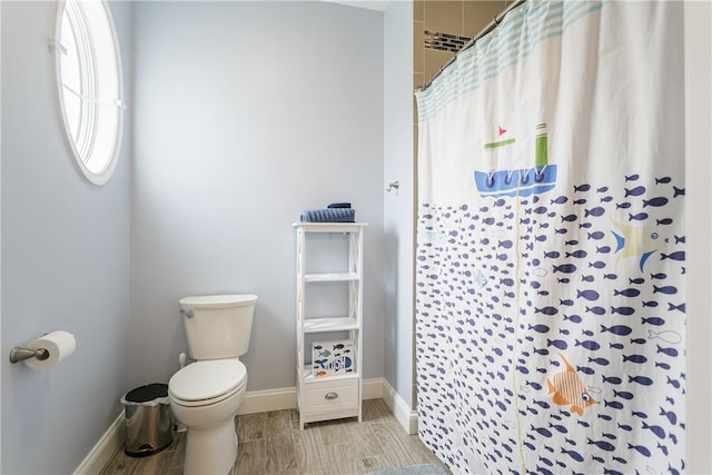 5088 E Lake Rd, Gorham, NY 14544 - full bath with toilet, baseboards, curtained shower, and wood finished floors