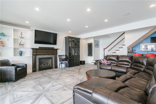 5088 E Lake Rd, Gorham, NY 14544 - living room with recessed lighting, stairway, and a glass covered fireplace