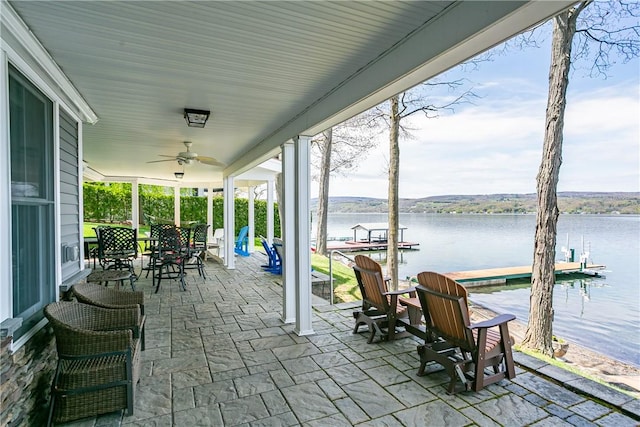 5088 E Lake Rd, Gorham, NY 14544 - view of patio featuring a floating dock, a ceiling fan, and a water view