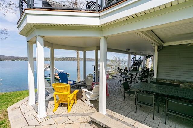 5088 E Lake Rd, Gorham, NY 14544 - view of patio with stairway, a water view, and a fire pit