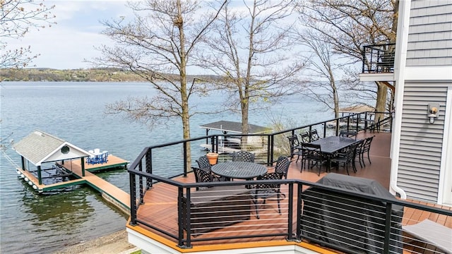 5088 E Lake Rd, Gorham, NY 14544 - wooden deck with a water view, outdoor dining space, a dock, a grill, and boat lift
