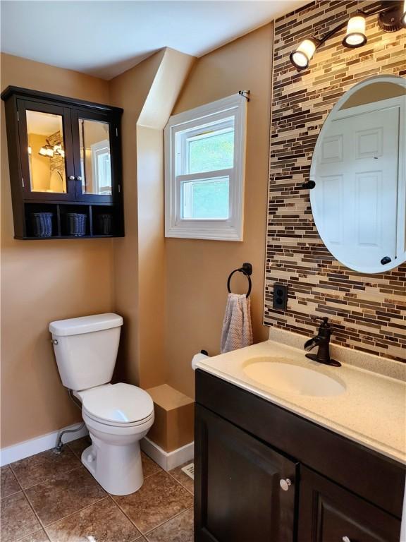 515 Park Pl, Erwin, NY 14870 - bathroom featuring baseboards, decorative backsplash, toilet, tile patterned floors, and vanity