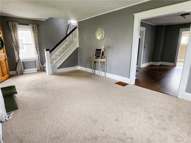 515 Park Pl, Erwin, NY 14870 - unfurnished living room featuring carpet floors, crown molding, baseboards, and stairs