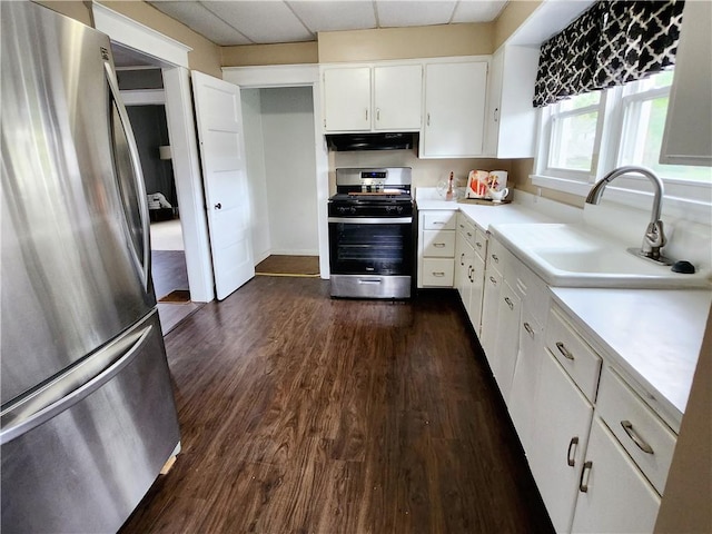 515 Park Pl, Erwin, NY 14870 - kitchen with appliances with stainless steel finishes, a sink, dark wood finished floors, light countertops, and white cabinets