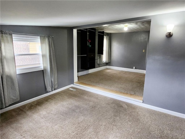 515 Park Pl, Erwin, NY 14870 - unfurnished room featuring healthy amount of natural light, carpet flooring, and baseboards