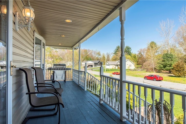 balcony featuring a residential view and a porch
