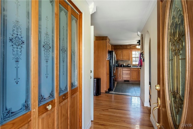 corridor with light wood-style floors