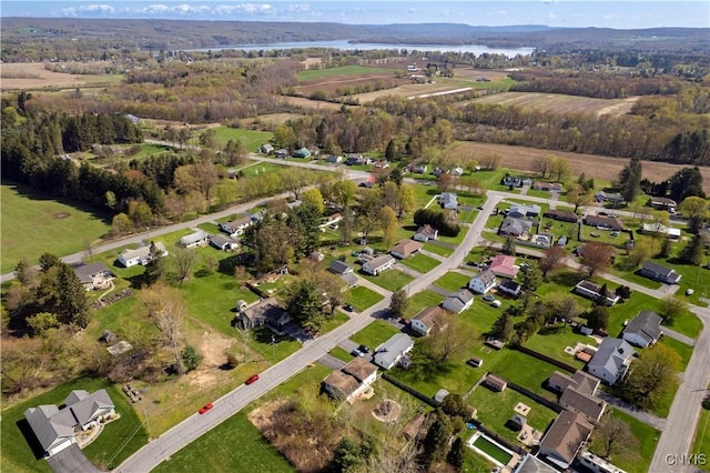 aerial overview of property's location featuring a nearby body of water and nearby suburban area