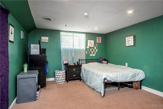 bedroom featuring carpet and baseboards