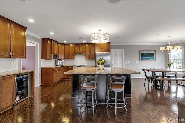 kitchen featuring appliances with stainless steel finishes, wine cooler, baseboards, dark wood-type flooring, and backsplash