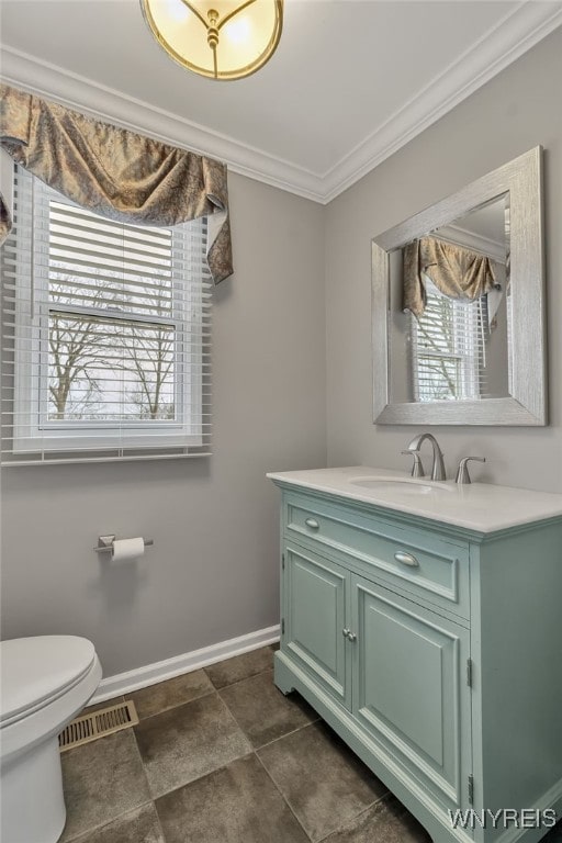 905 Sullivan Ct, Lewiston, NY 14092 - bathroom featuring ornamental molding, baseboards, vanity, and toilet