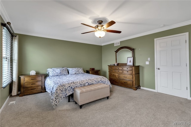carpeted bedroom featuring multiple windows, crown molding, baseboards, and a ceiling fan