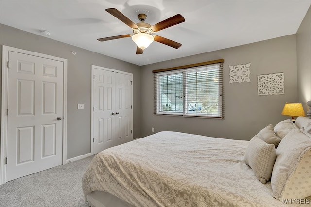 carpeted bedroom with a closet, a ceiling fan, and baseboards