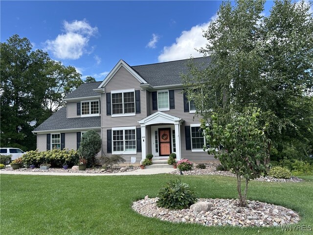 905 Sullivan Ct, Lewiston, NY 14092 - colonial house featuring a front lawn and roof with shingles