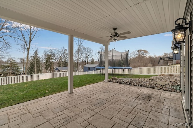 view of patio featuring a trampoline and ceiling fan