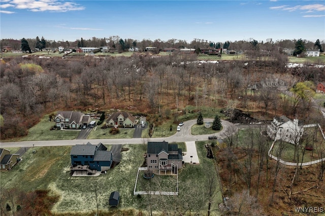 aerial view of property and surrounding area with nearby suburban area