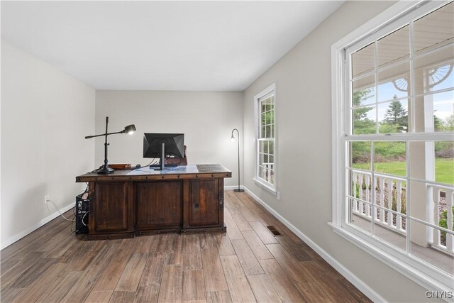 office space featuring wood finished floors and baseboards