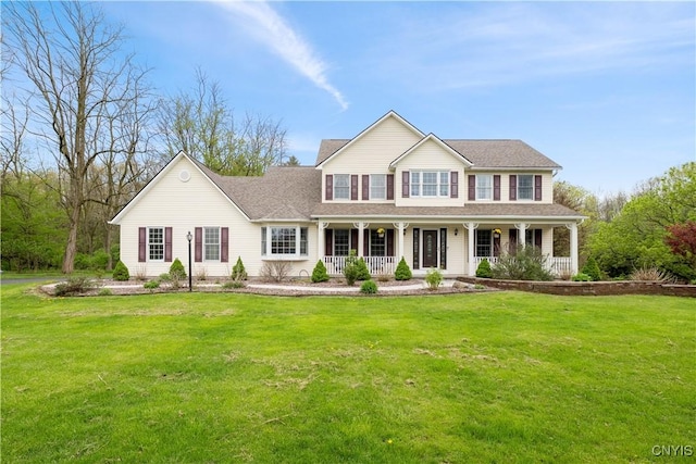 view of front of house featuring covered porch and a front lawn