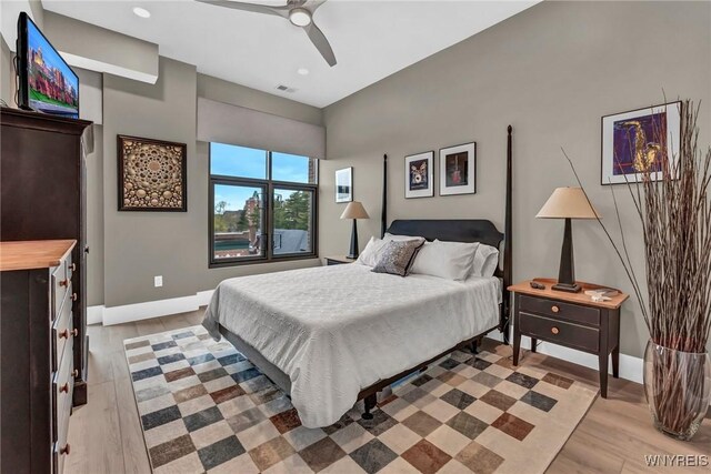 bedroom with baseboards, light wood-type flooring, recessed lighting, and a ceiling fan