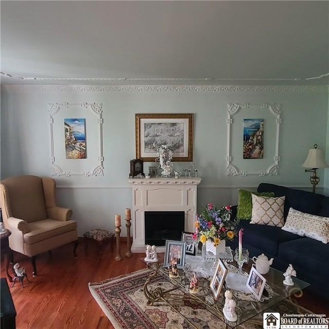 384 Flickerwood Rd, Kane-Borough, PA 16735 - living room featuring wood finished floors and a fireplace with raised hearth