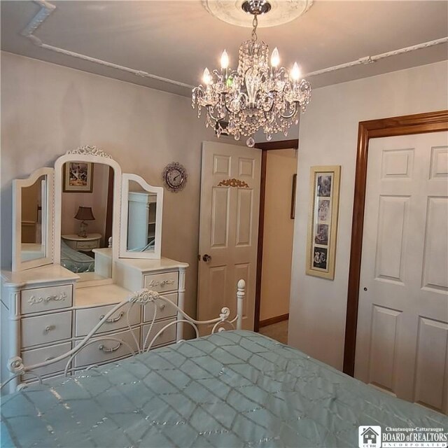 384 Flickerwood Rd, Kane-Borough, PA 16735 - bedroom featuring a chandelier