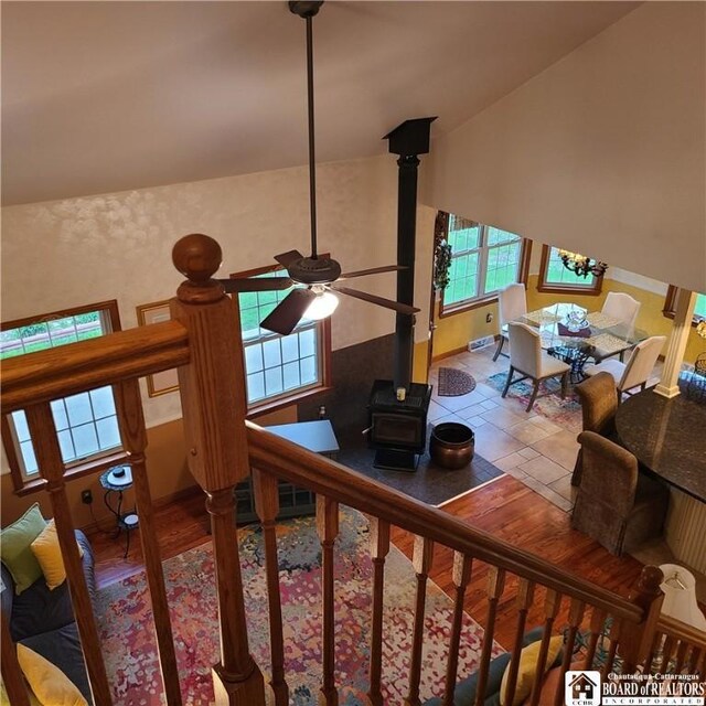 384 Flickerwood Rd, Kane-Borough, PA 16735 - living area with a wood stove, ceiling fan, baseboards, and lofted ceiling
