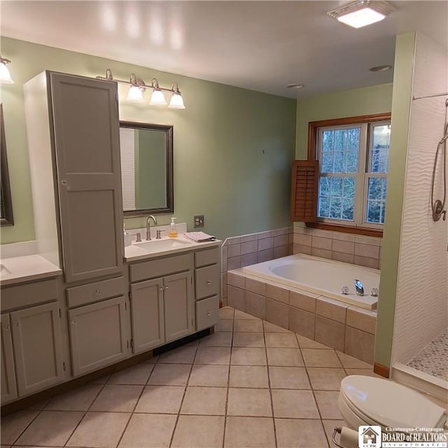 384 Flickerwood Rd, Kane-Borough, PA 16735 - full bathroom featuring tile patterned flooring, a garden tub, toilet, vanity, and a shower