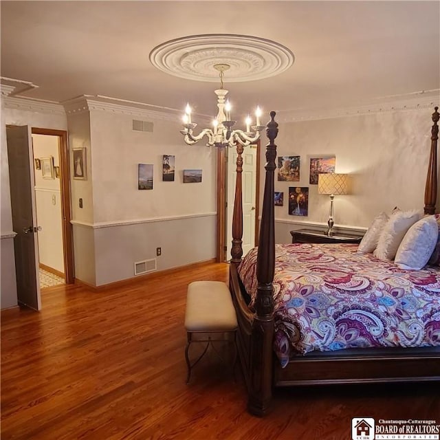 384 Flickerwood Rd, Kane-Borough, PA 16735 - bedroom featuring crown molding, a chandelier, and wood finished floors