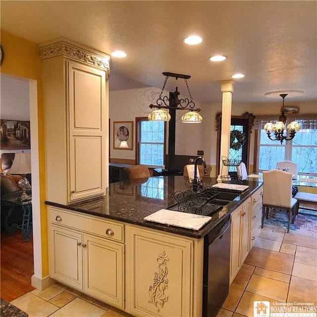 384 Flickerwood Rd, Kane-Borough, PA 16735 - kitchen featuring dishwasher, cream cabinets, a chandelier, ornate columns, and light tile patterned flooring