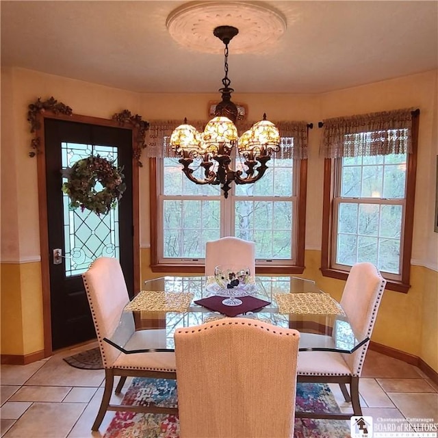 384 Flickerwood Rd, Kane-Borough, PA 16735 - dining room featuring a chandelier, light tile patterned flooring, and baseboards