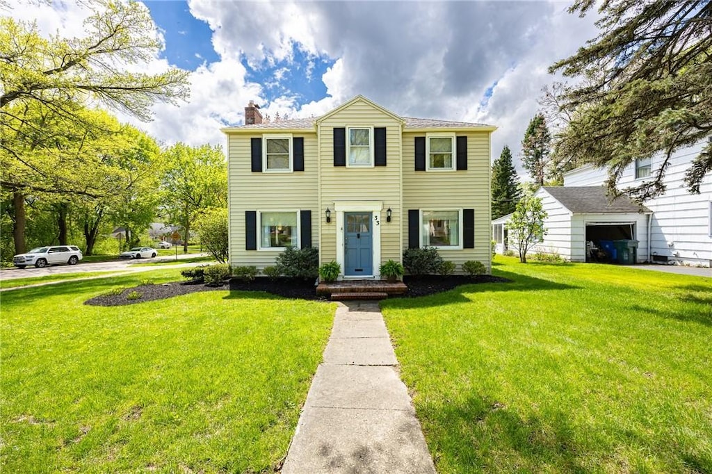 33 Morven Rd, Rochester, NY 14610 - view of front of property featuring a chimney and a front lawn
