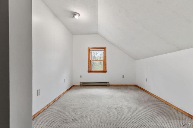 1826 Cardner Rd, Fabius, NY 13122 - bonus room featuring baseboard heating, light carpet, lofted ceiling, and baseboards