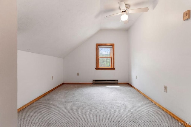 1826 Cardner Rd, Fabius, NY 13122 - additional living space featuring baseboard heating, light carpet, vaulted ceiling, a ceiling fan, and baseboards