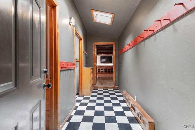 1826 Cardner Rd, Fabius, NY 13122 - corridor with dark flooring and vaulted ceiling