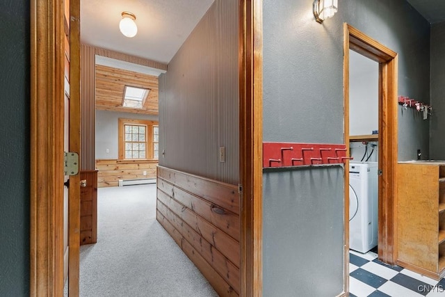 1826 Cardner Rd, Fabius, NY 13122 - hall featuring washer / dryer, wooden walls, a baseboard heating unit, and tile patterned floors